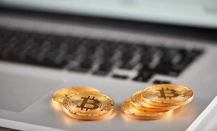 Golden Bitcoins are on the laptop