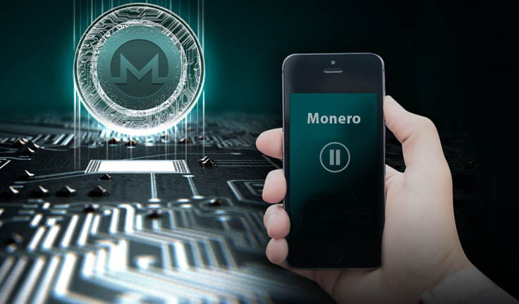 Smartphone in hand with Monero written on it